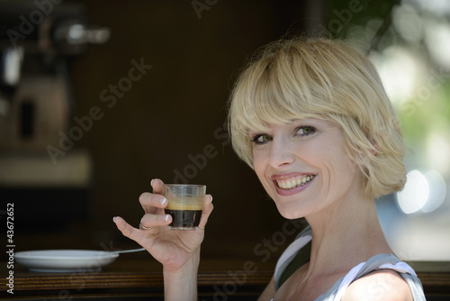 Photo: Woman having a coffee break Woman having a coffee break