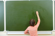 Girl by the blackboard