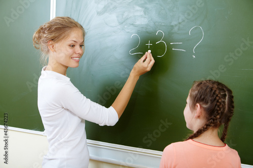 Photo: By the blackboard By the blackboard