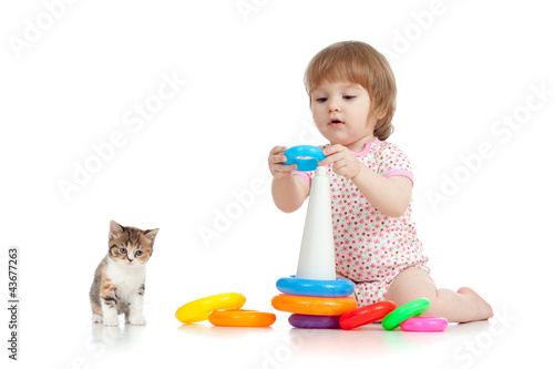 Photo: pretty little child or kid playing with color toy pretty little child or kid playing with color toy