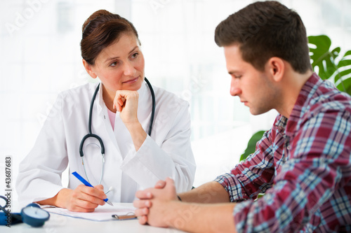 Photo: doctor with male patient doctor with male patient