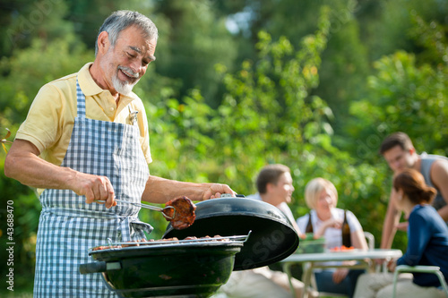 Photo: Family having a barbecue party Family having a barbecue party