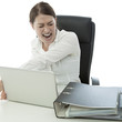 young brunette business woman in rage and throw laptop of desk