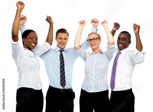 Photo: Business team of four celebrating success Business team of four celebrating success