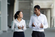 Photo: Business people walking outside Business people walking outside