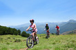 Family Riding Bikes In The Mou...