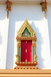 Photo: Native Thai style carving, painting on church door in the temple Native Thai style carving, painting on church door in the temple