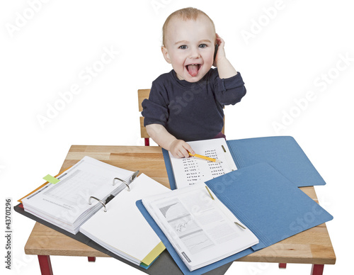 Photo: young child at writing desk young child at writing desk