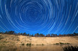 stars around the Pole Star in the background of the river