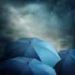 Dark clouds and umbrellas