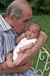 Senior Man Holding His Great-grandson