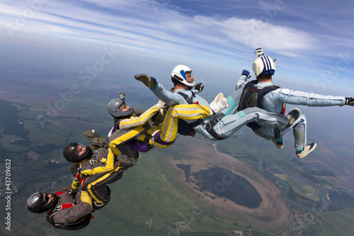 Photo: Five skydivers free-fall in the figure. Five skydivers free-fall in the figure.