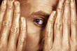 Eye of the young men in the gold make-up