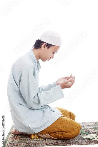 Photo: Muslim man worshiping on mat Muslim man worshiping on mat