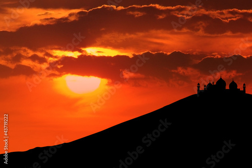 Photo: Silhouette of mosque on mountain Silhouette of mosque on mountain