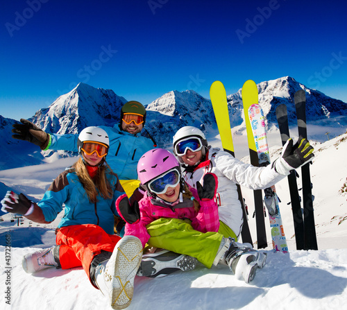 Photo: Skiing, winter fun - happy family ski team Skiing, winter fun - happy family ski team