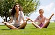 Foto: Mother and daughter meditating together Mother and daughter meditating together