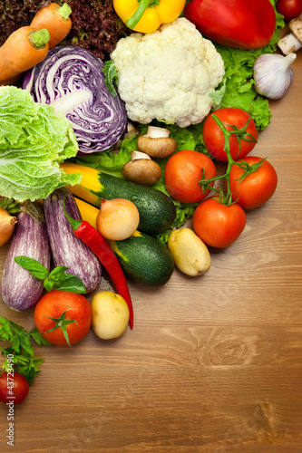 Photo: Fresh Organic Vegetables / on the Wooden Desk Fresh Organic Vegetables / on the Wooden Desk