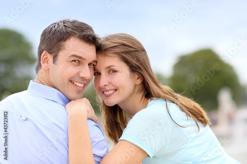 Photo: Couple of lovers in public park Couple of lovers in public park