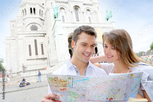 Photo: Couple in Montmartre reading tourist map Couple in Montmartre reading tourist map
