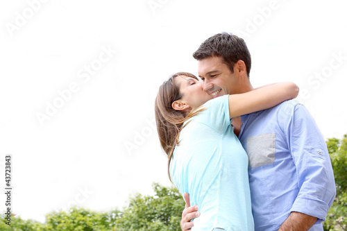 Photo: Girl kissing boyfriend on a date Girl kissing boyfriend on a date