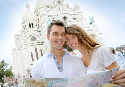 Photo: Couple in Montmartre reading tourist map Couple in Montmartre reading tourist map