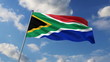 Vídeo: South African flag waving against clouds background South African flag waving against clouds background