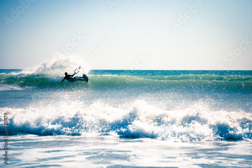 Photo: Kite surfing in waves. Kite surfing in waves.