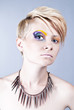 Photo: Beautiful young female with bright impudent make up Beautiful young female with bright impudent make up