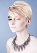 Photo: Beautiful young female with bright impudent make up Beautiful young female with bright impudent make up
