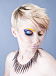 Photo: Beautiful young female with bright impudent make up Beautiful young female with bright impudent make up