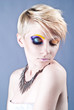Photo: Beautiful young female with bright impudent make up Beautiful young female with bright impudent make up