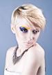 Photo: Beautiful young female with bright impudent make up Beautiful young female with bright impudent make up