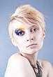 Photo: Beautiful young female with bright impudent make up Beautiful young female with bright impudent make up