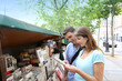 Couple in Paris looking at booksellers