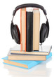 Headphones on books isolated on white