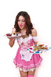 Pretty woman eating cakes. Isolated on the white background