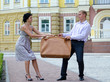 Photo: Stylish couple fighting over luggage Stylish couple fighting over luggage