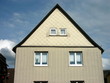 Klinkerfassade eines Einfamilienhauses mit spitzem Giebel