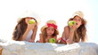 Little girls eating apples
