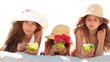 Little girls eating apples