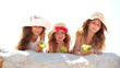 Little girls eating apples