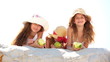 Little girls eating apples