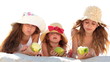 Little girls eating apples