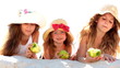 Little girls eating apples