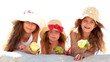 Little girls eating apples