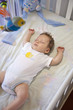 Photo: Bimbo che dorme beatamente nella sua culla Bimbo che dorme beatamente nella sua culla