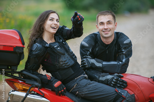 Photo: couple on bike couple on bike