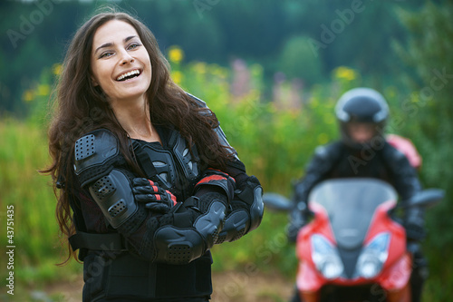 Photo: Young female motorcyclist Young female motorcyclist