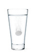 Fizzy tablet in glass of water